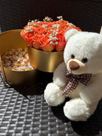 White teddy bear with a bouquet of flowers on a textured surface - Lovy Details Miami